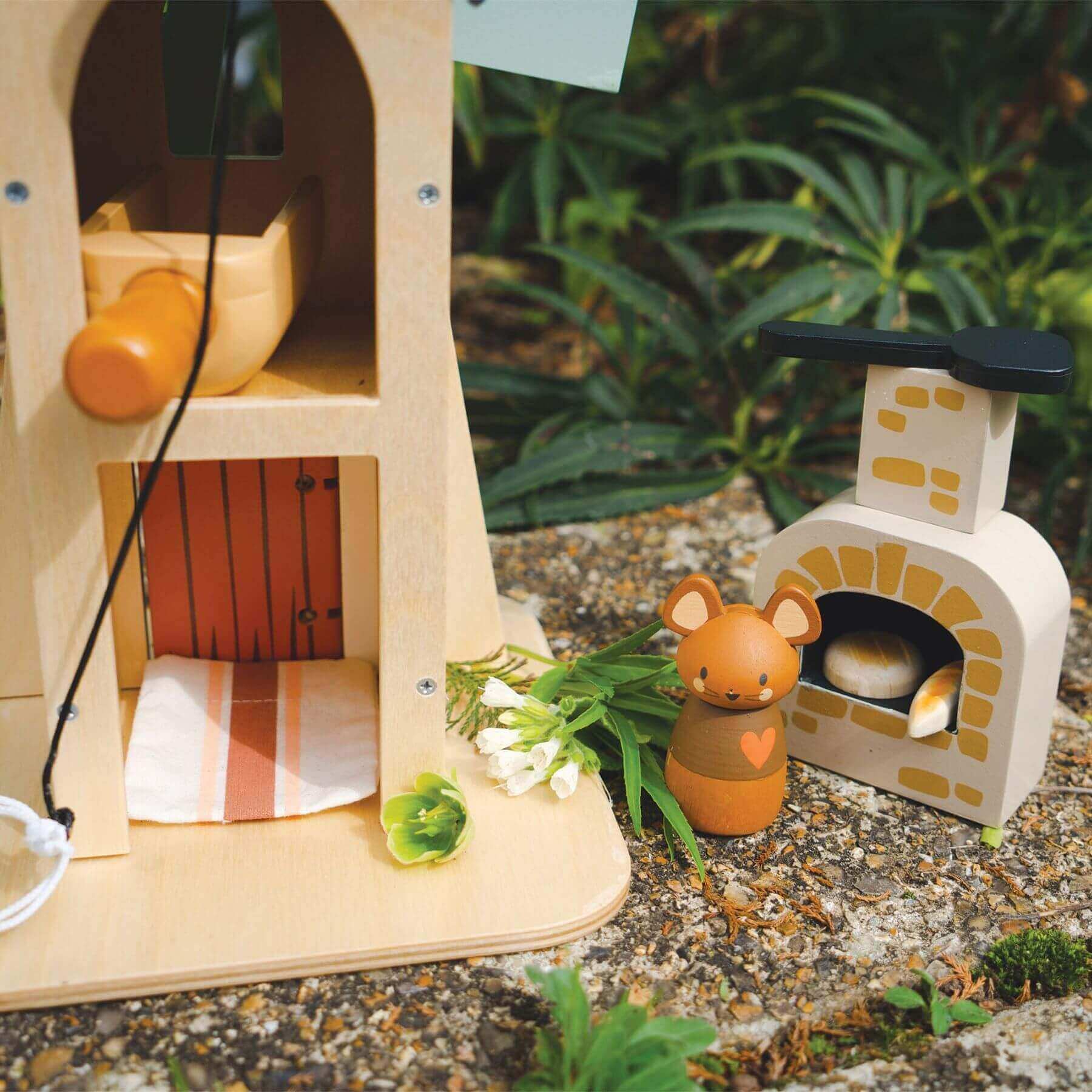 Tender Leaf Penny Windmill with a small garden setup on a natural background