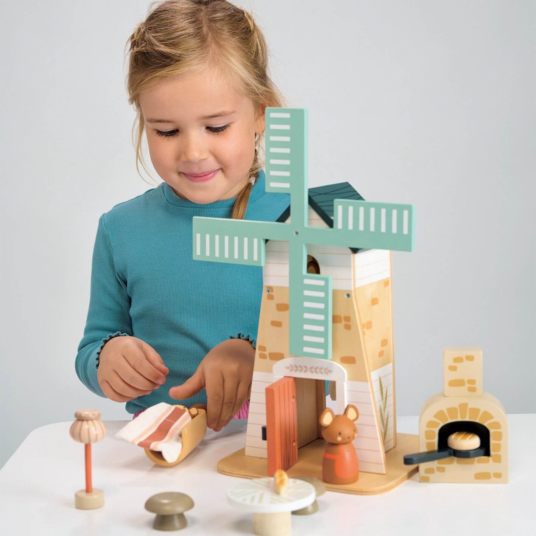 Child playing with Tender Leaf Penny Windmill