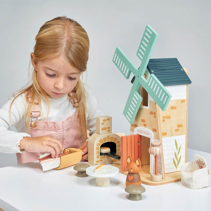 Child playing with Tender Leaf Penny Windmill