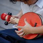 Boy Playing PlanToys Banjo