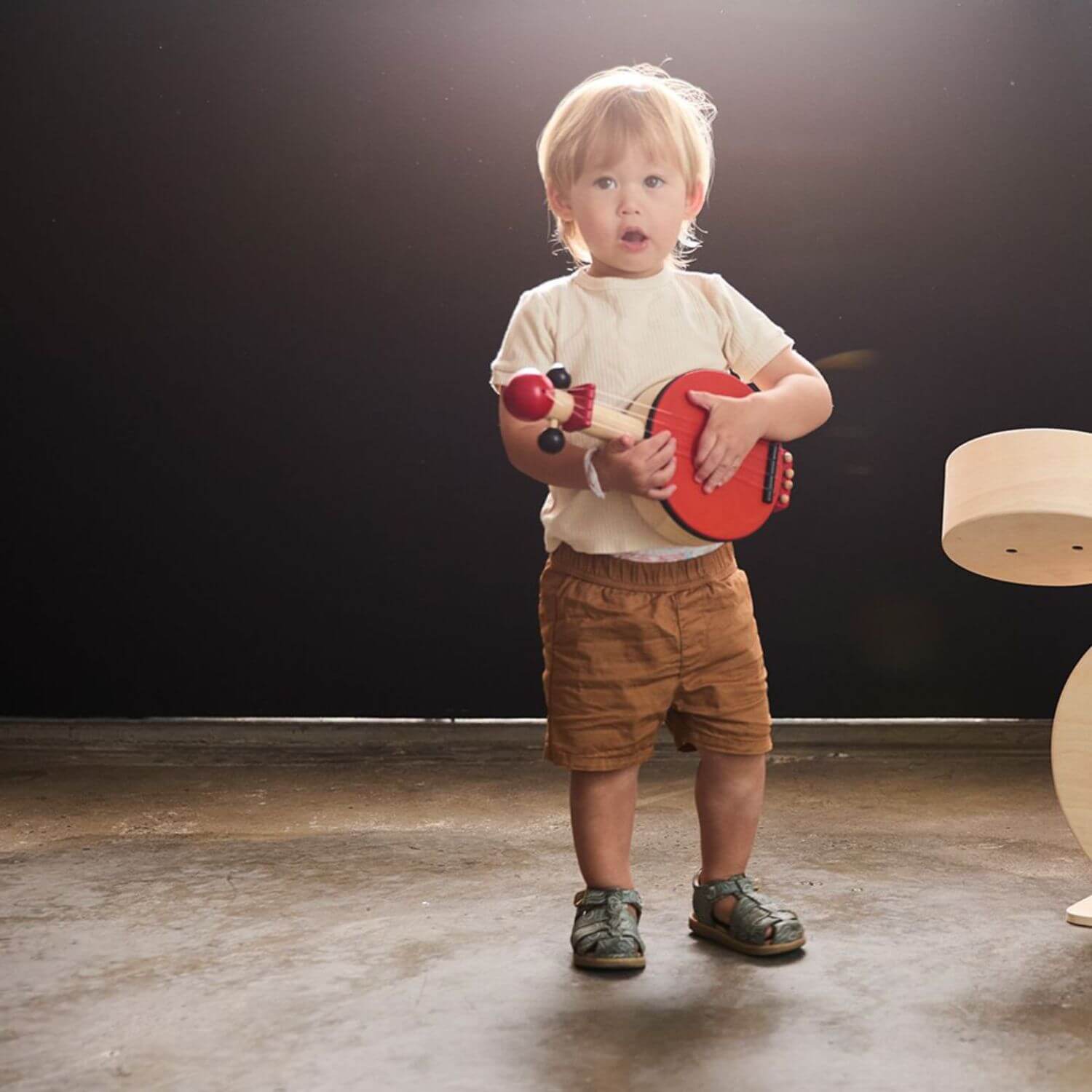 Boy Playing PlanToys Banjo