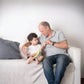 Dad and Kid Playing PlanToys Banjolele