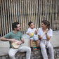 Parents and Kid Playing PlanToys Banjolele