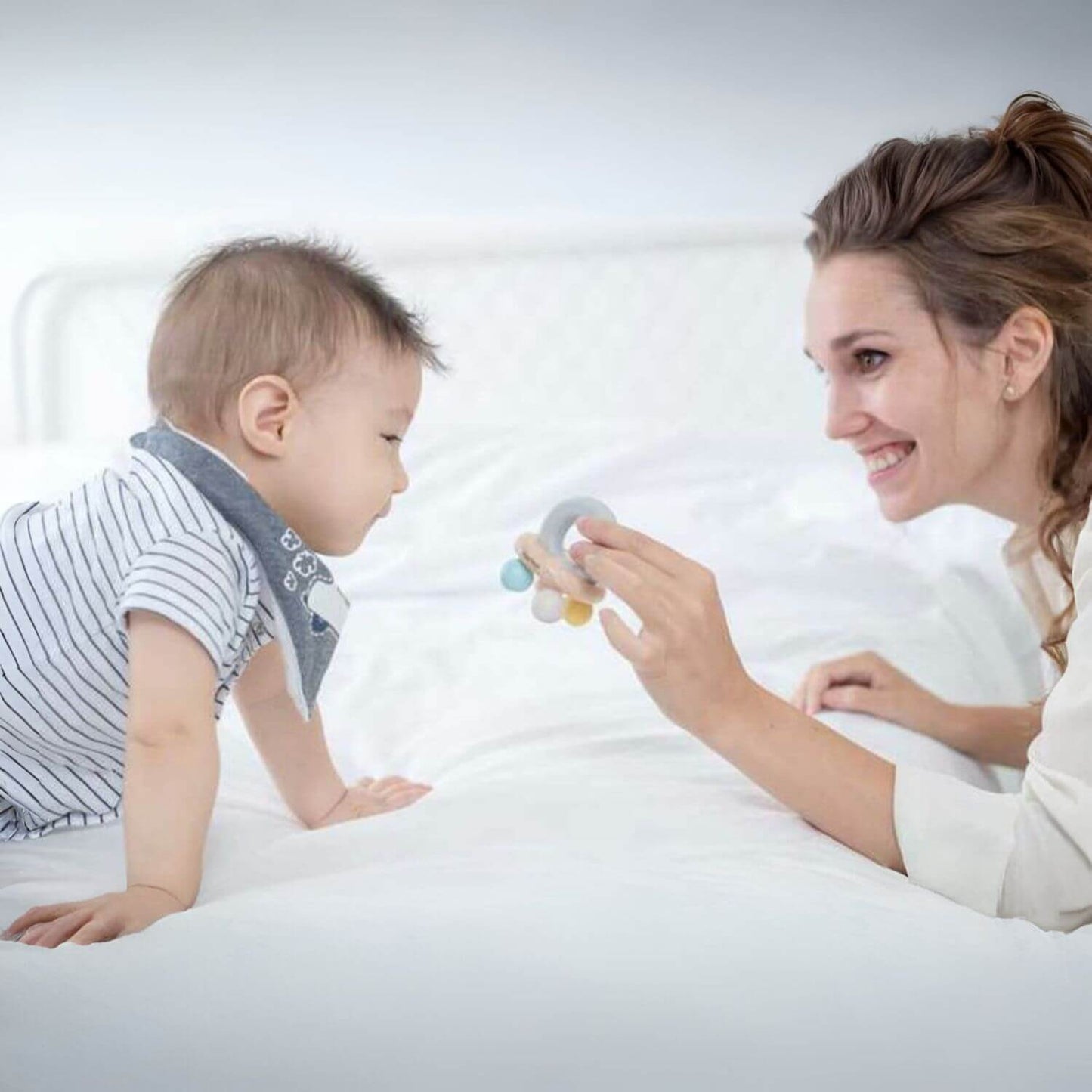 Mom & Baby Playing PlanToys Bell Rattle