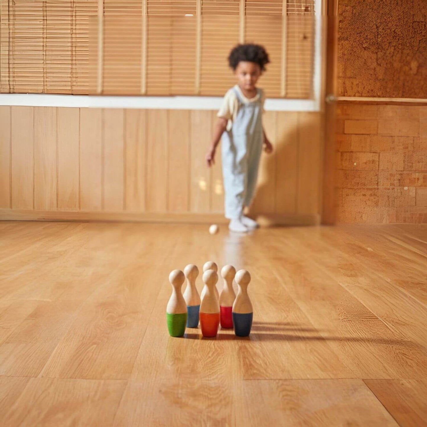 Boy Playing PlanToys Bowling Set