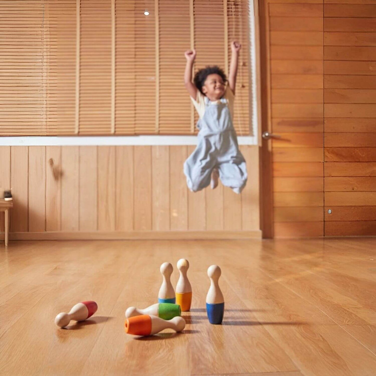 Boy Playing PlanToys Bowling Set