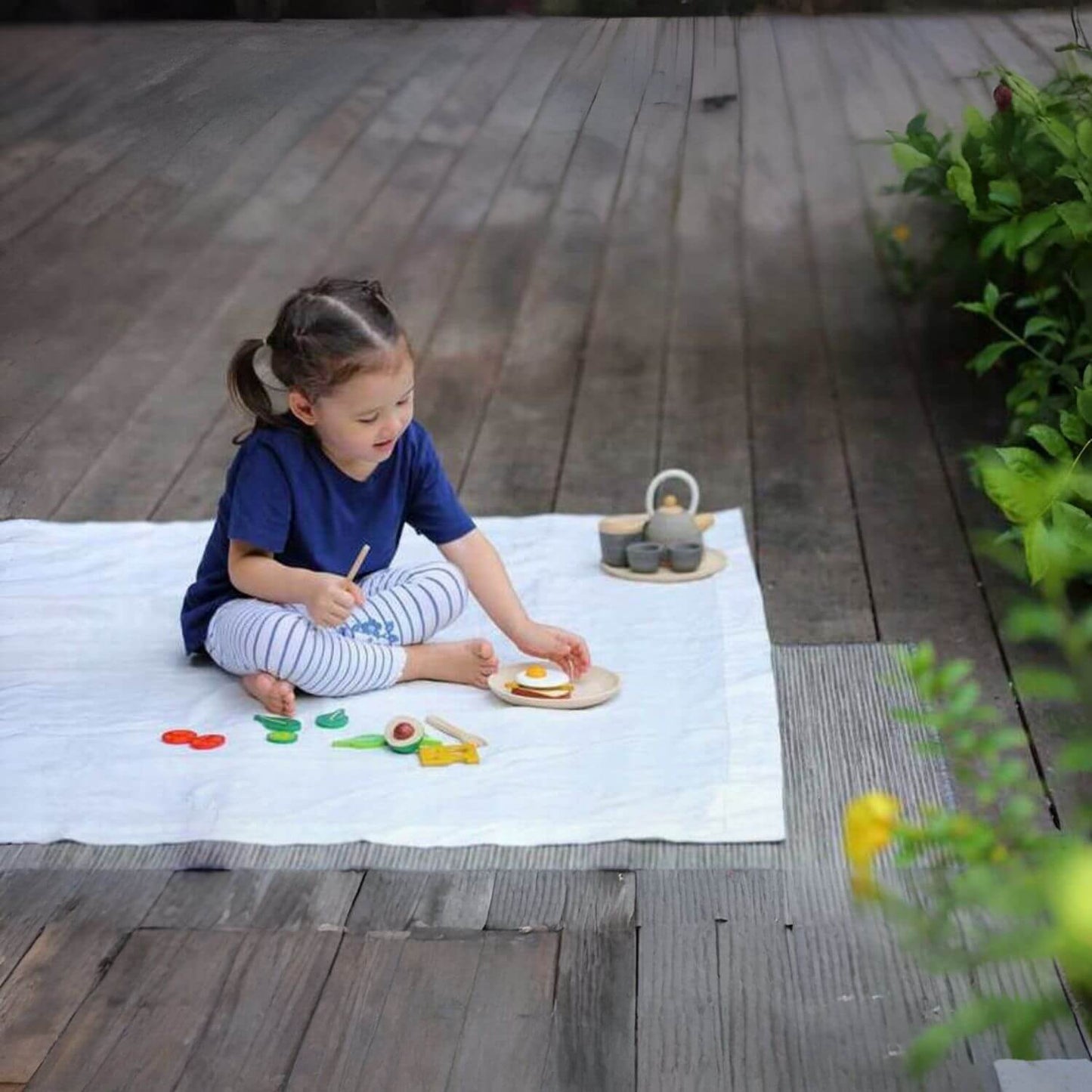 Girl Playing PlanToys Breakfast