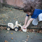 Boy Playing PlanToys Bulldozer