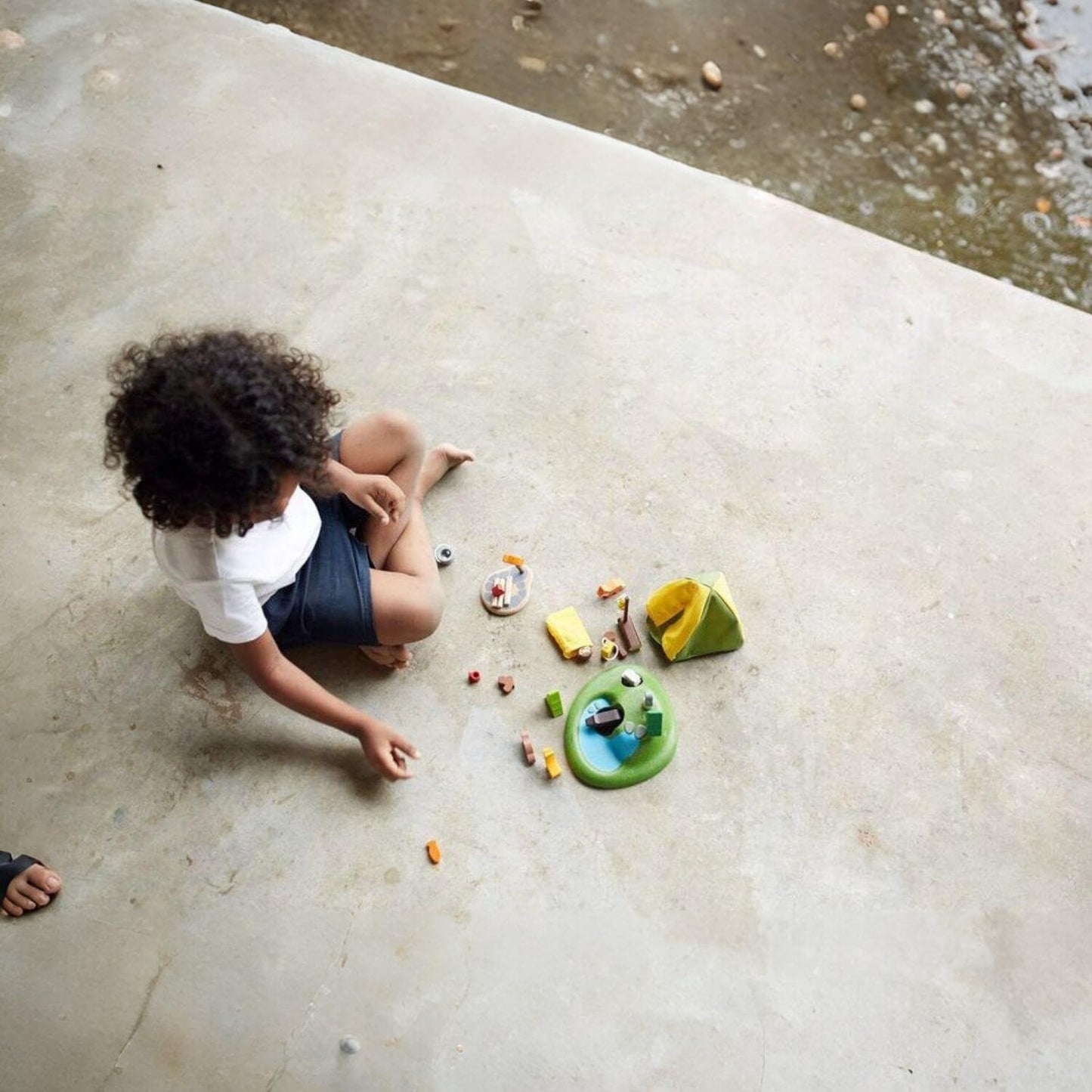 Boy Playing PlanToys Camping Set