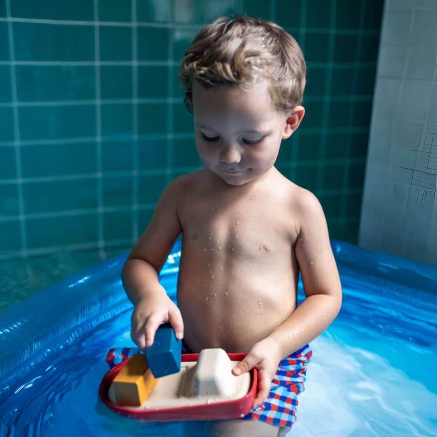 Boy Playing PlanToys Cargo Ship