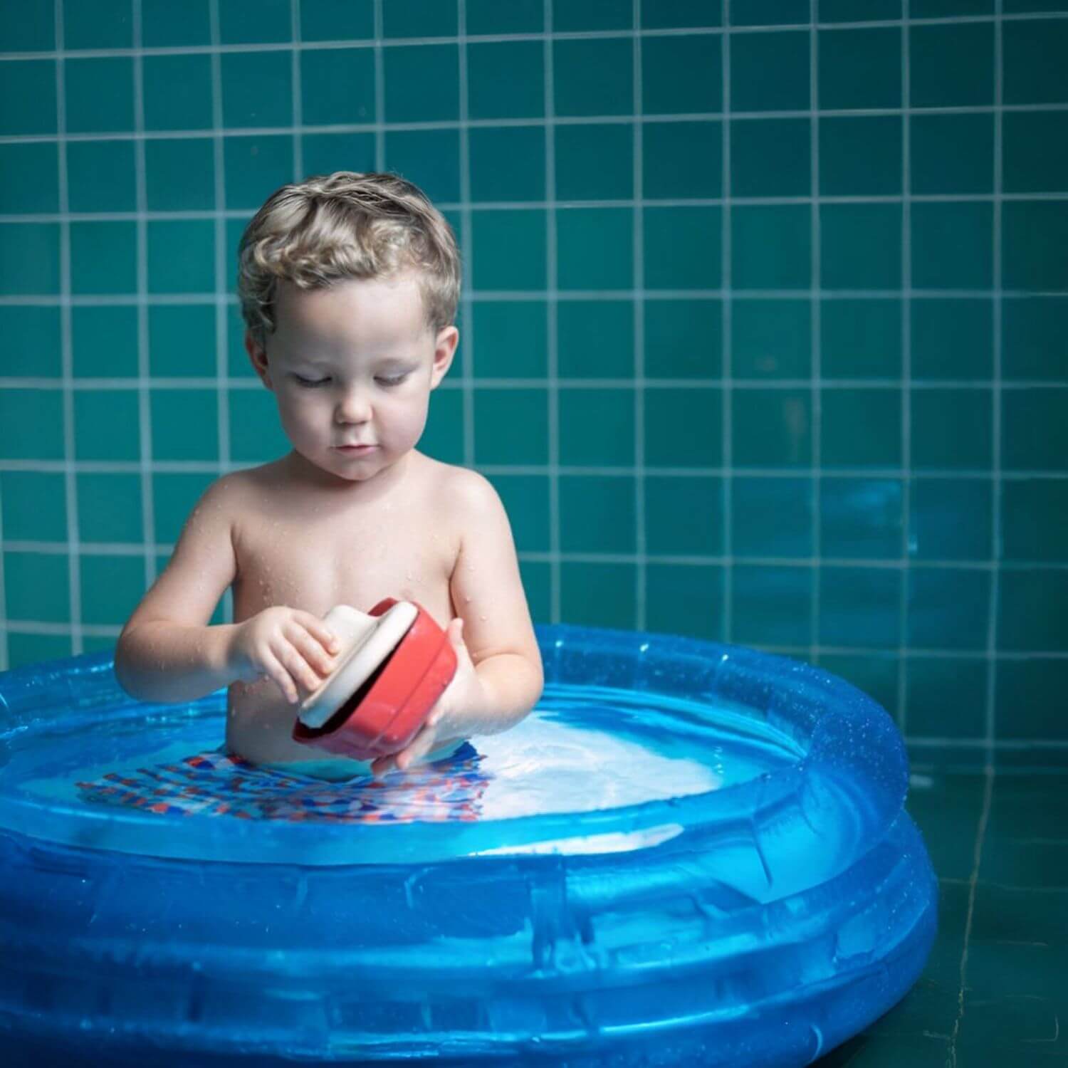 Boy Playing PlanToys Cargo Ship