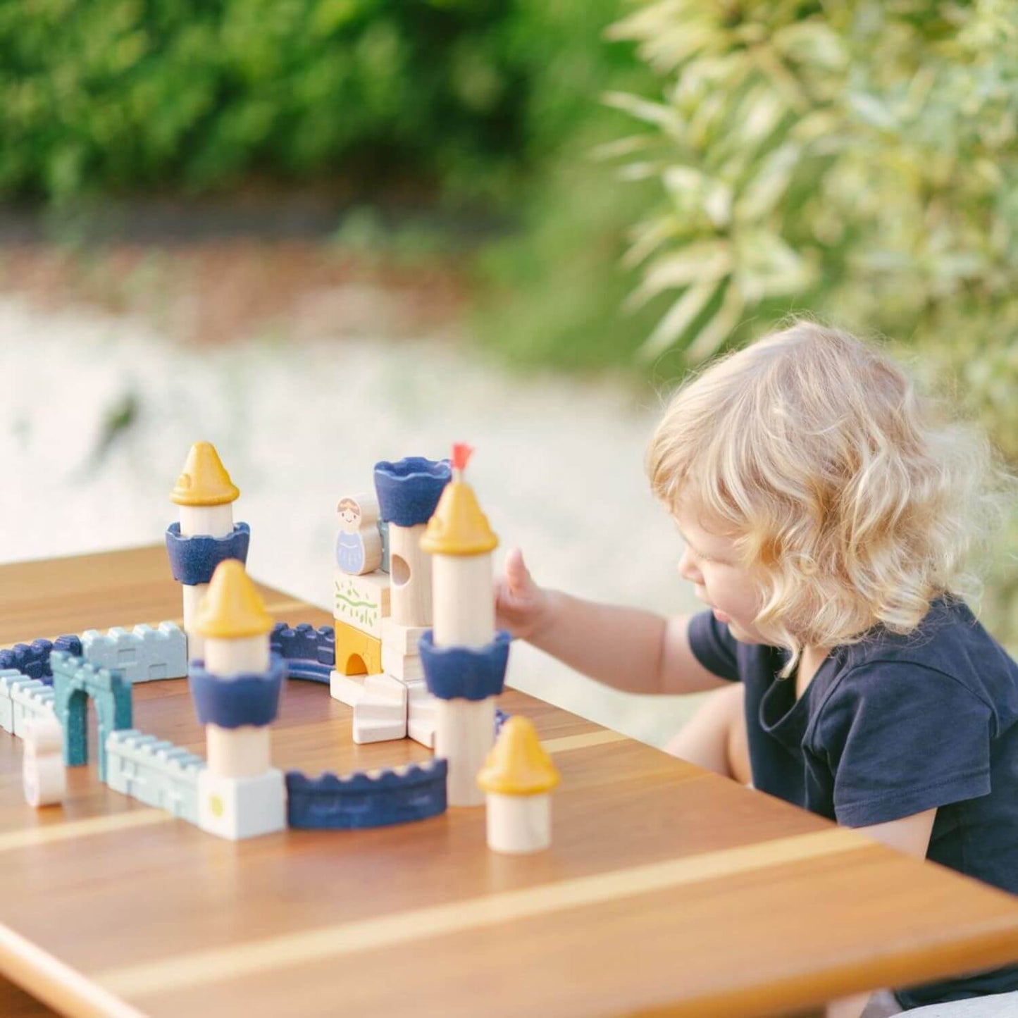 Kid Playing PlanToys Castle Blocks