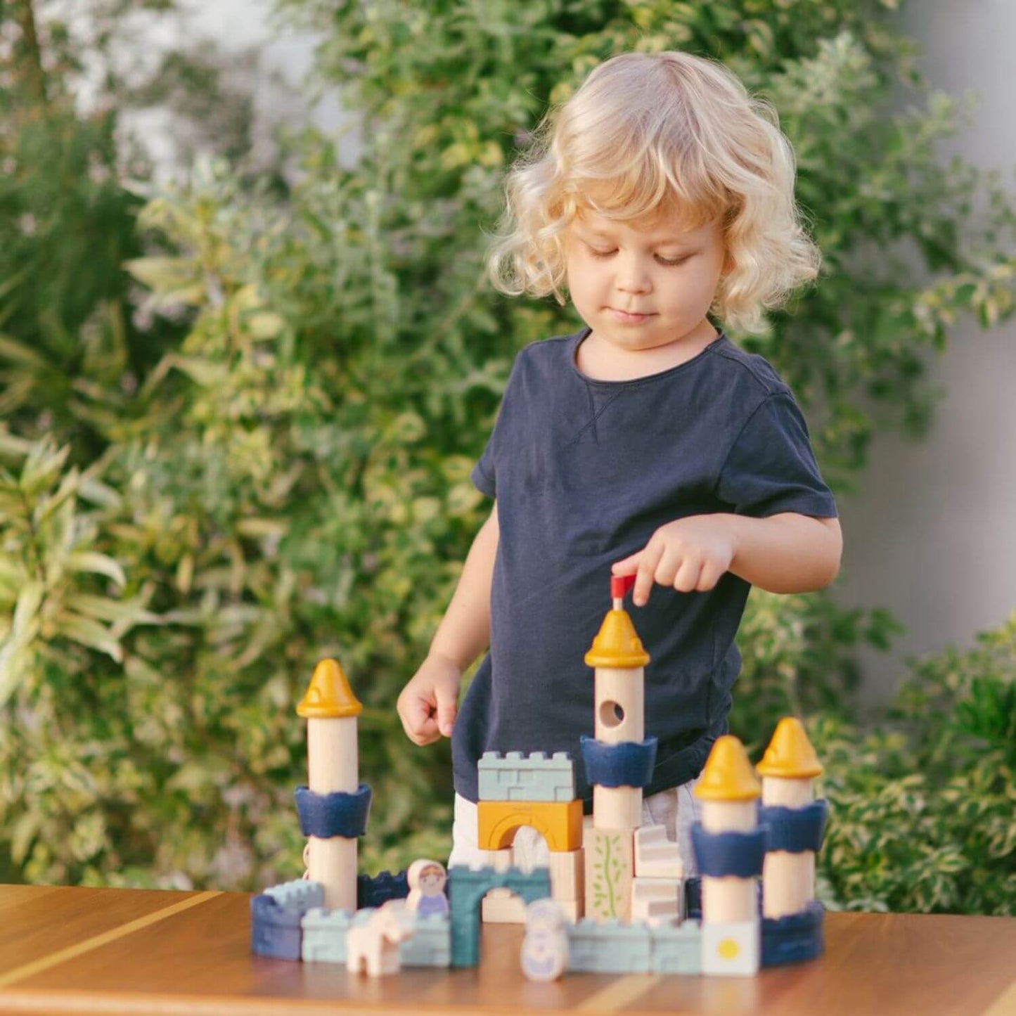Kid Playing PlanToys Castle Blocks