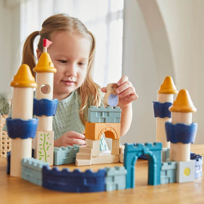 Girl Playing PlanToys Castle Blocks