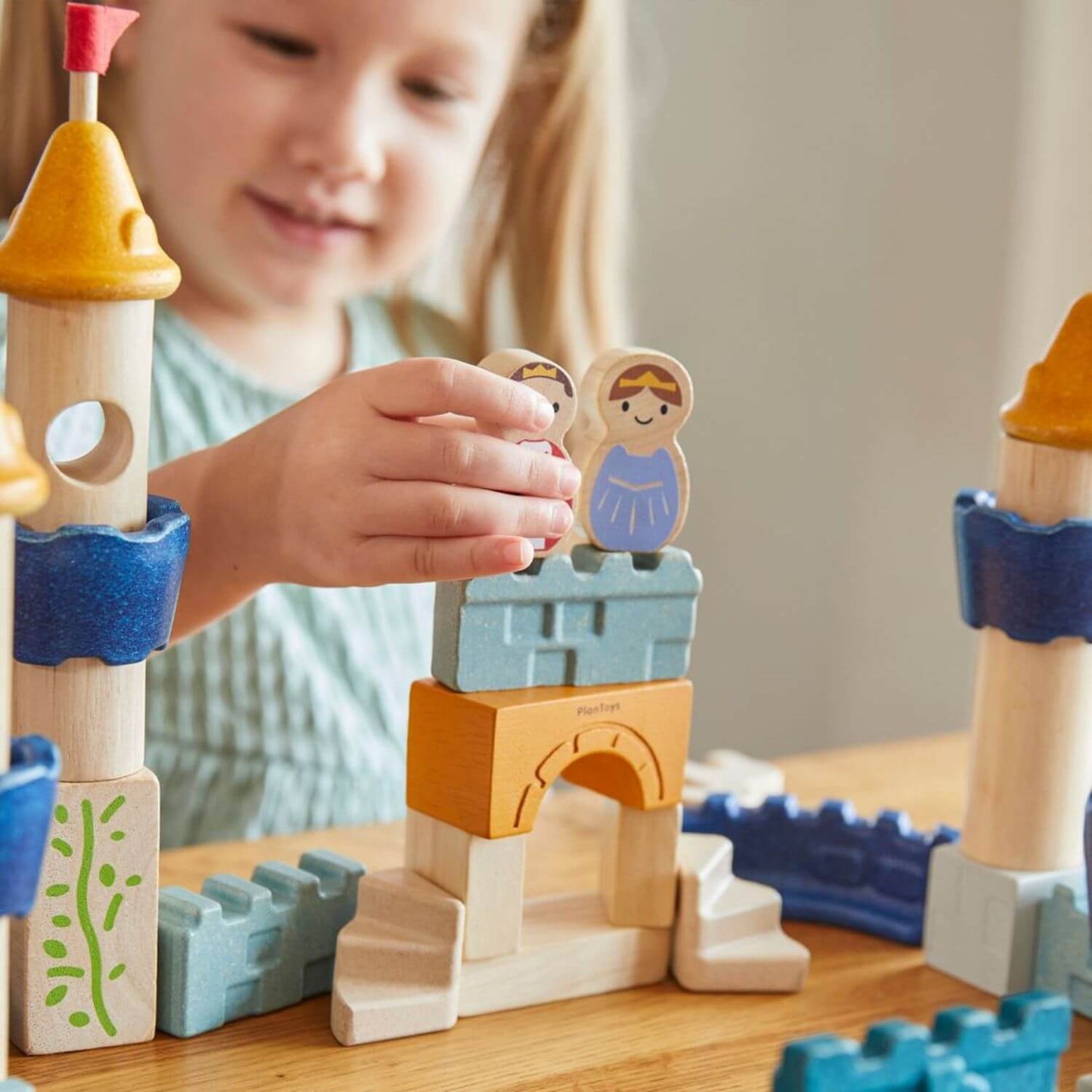 Girl Playing PlanToys Castle Blocks