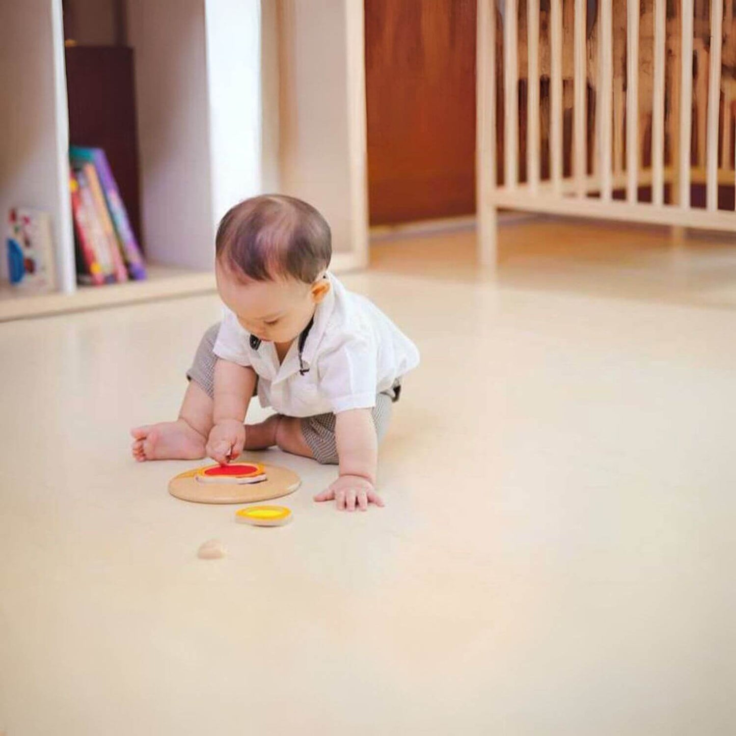 Boy Playing PlanToys Chicken Puzzle