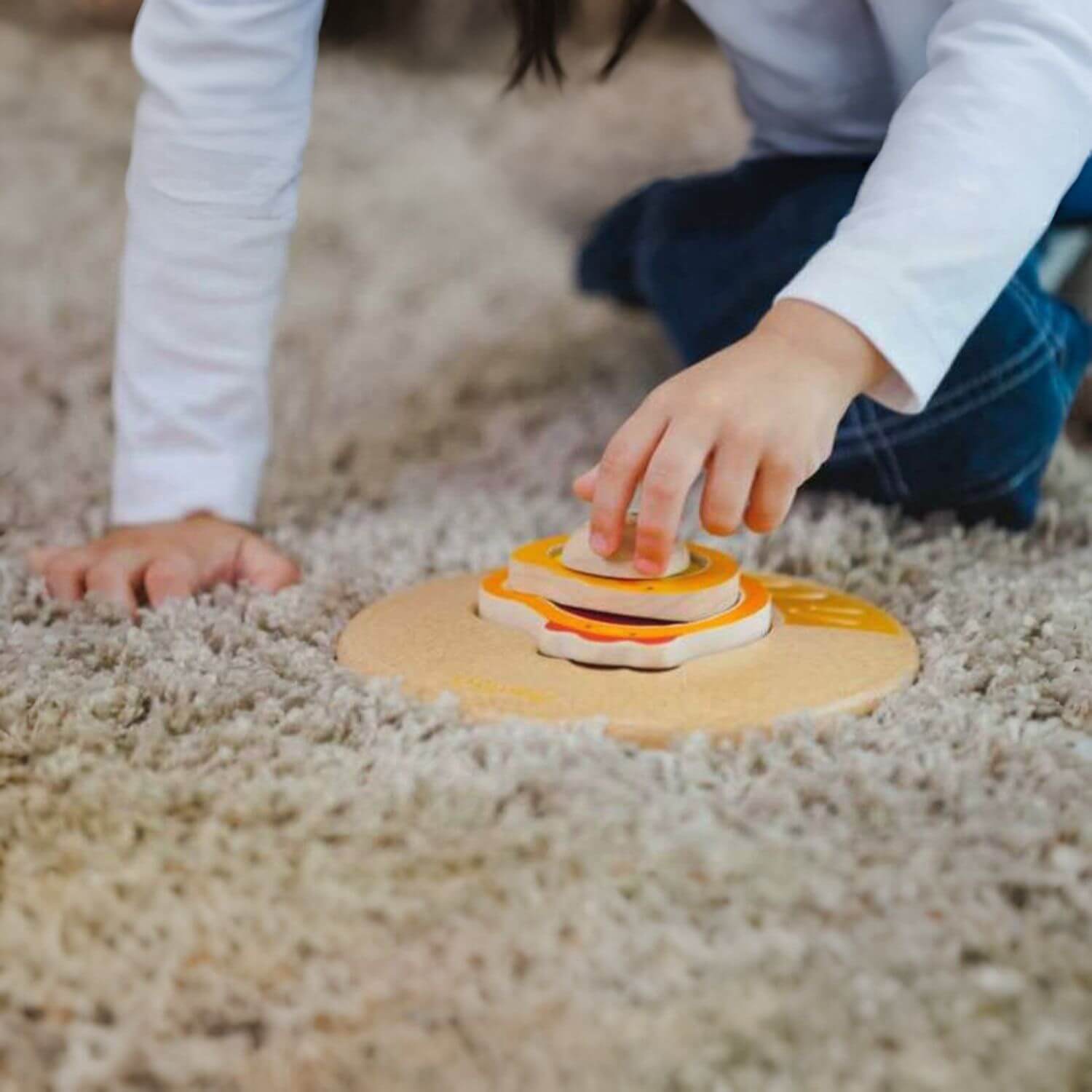 Kid Playing PlanToys Chicken Puzzle