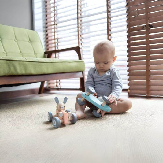 Baby Playing PlanToys Chicken Racing Car