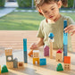 Girl Playing PlanToys Cityscape Blocks