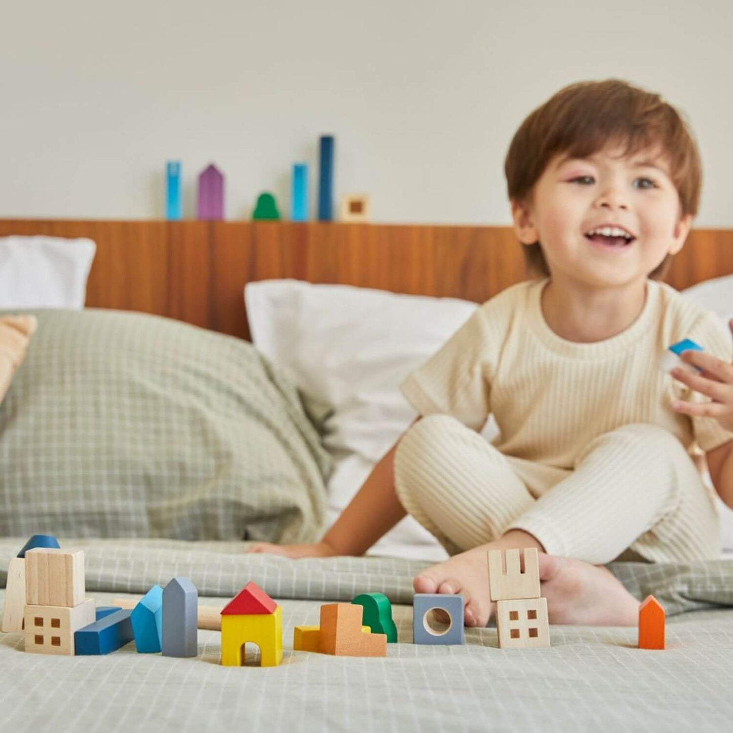 Kid Playing PlanToys Cityscape Blocks