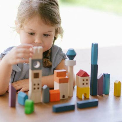 Girl Playing PlanToys Cityscape Blocks