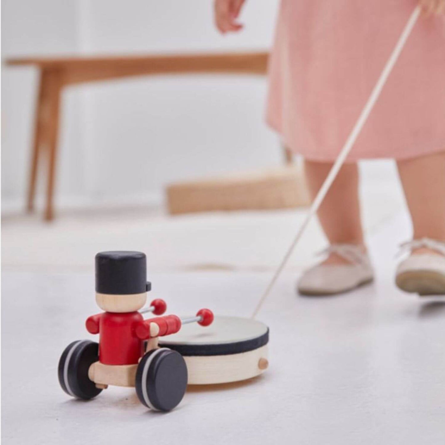 PlanToys Pull Along Drummer pulled by a child