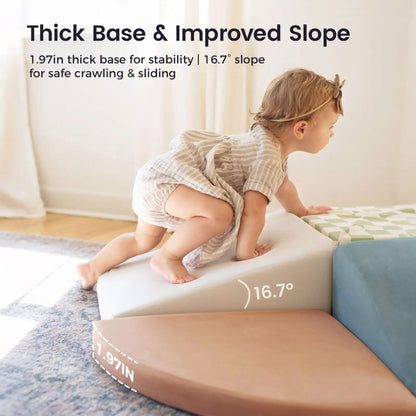 A baby climbing on Tiny Land® PlayNest Climbing Blocks - Morandi in a bright indoor room.