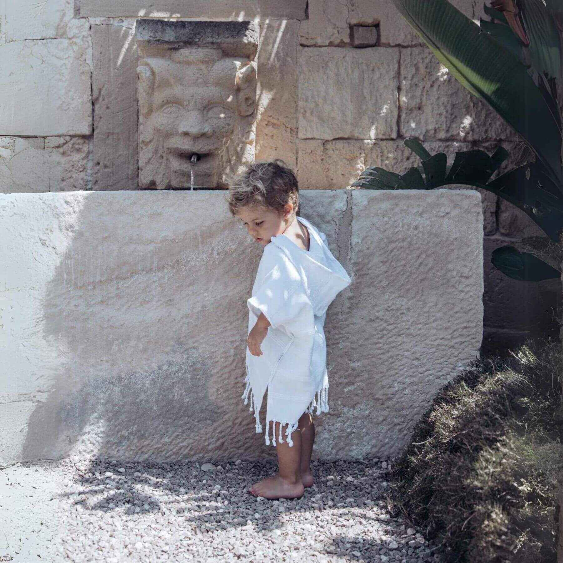 Boy Wearing Unique Love Design Poncho Pure White