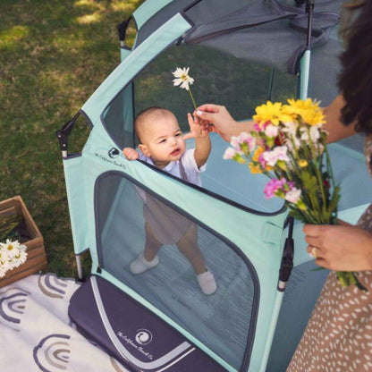 Baby Playing inside The California Beach Co. Pop 'N Go™ Playpen Mint