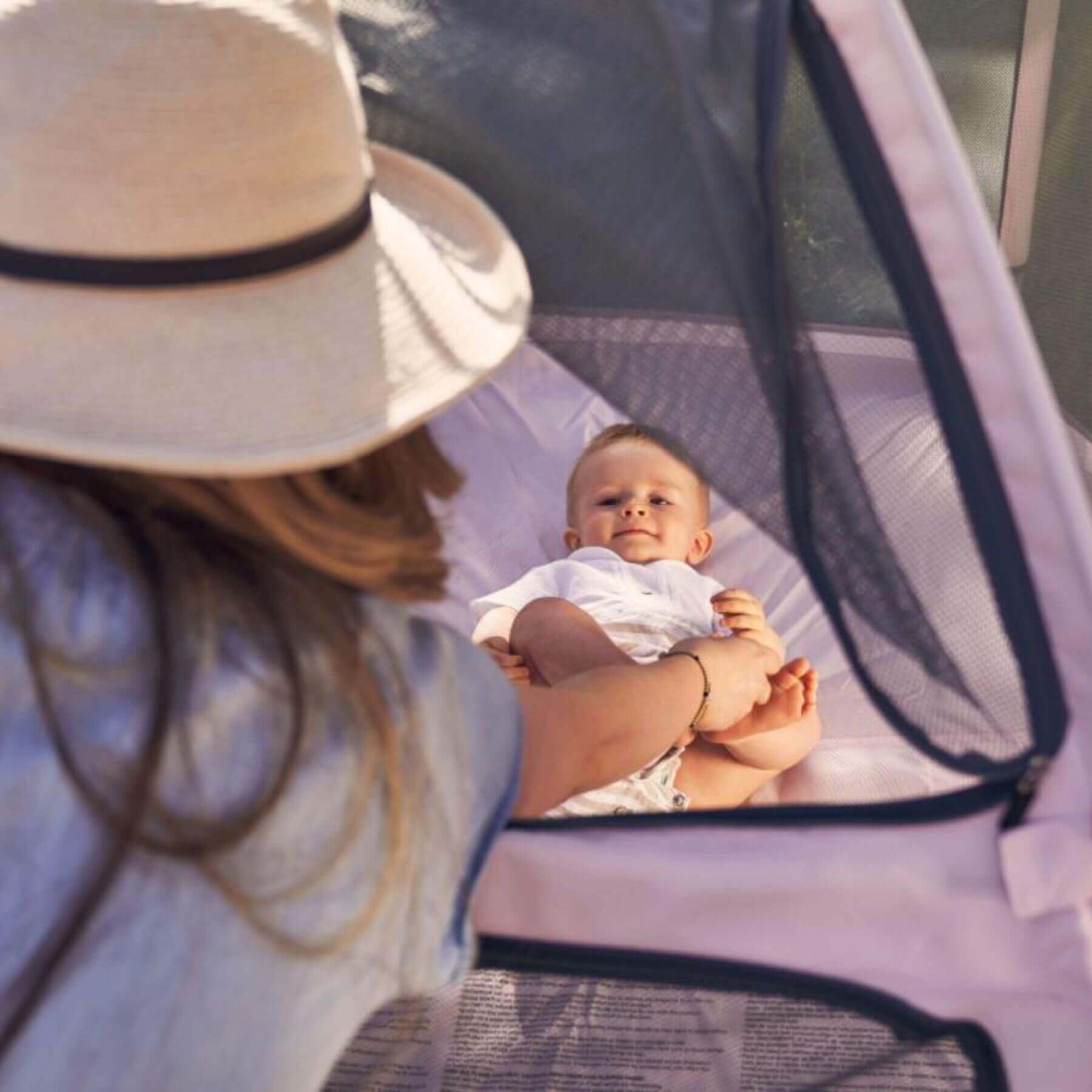 Mom Lying inside Pop 'N Go™ Playpen