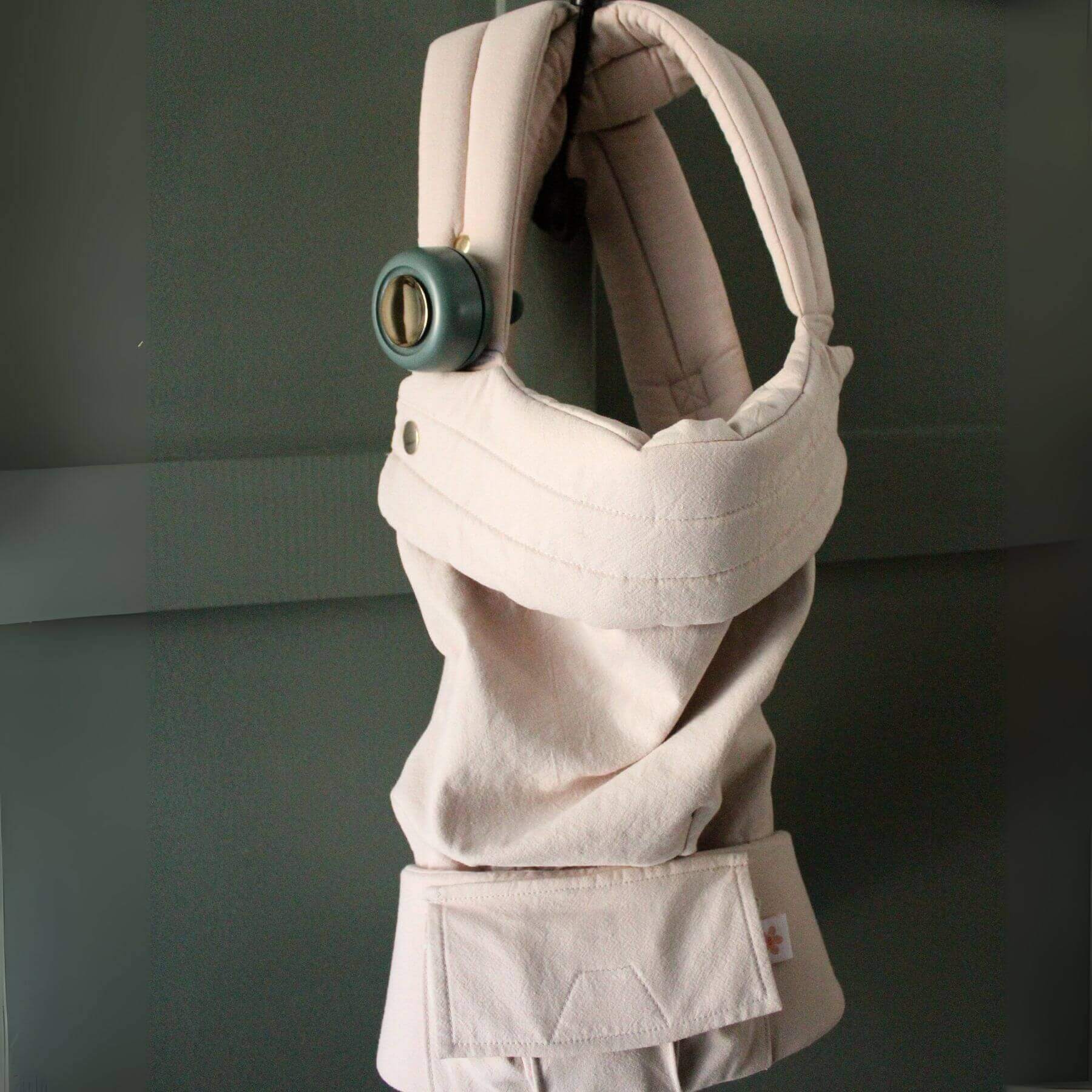 Beige baby carrier with green Coco Carriers Portable Rechargeable Fan