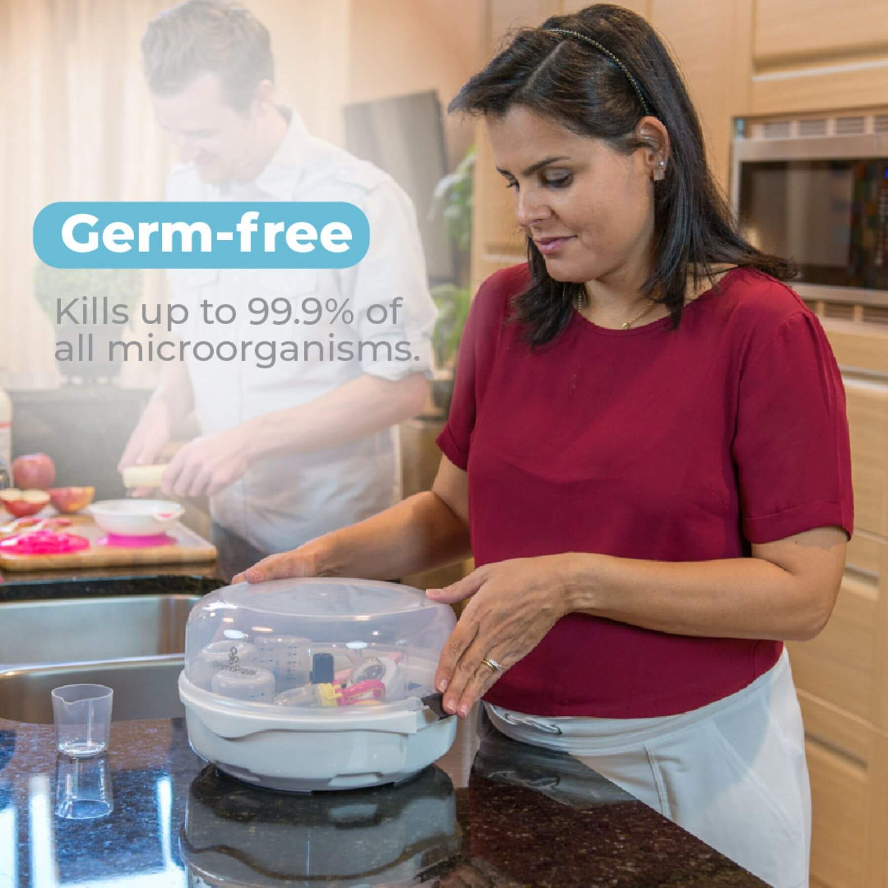 Woman holding Primo Passi Microwave Baby Bottle Sterilizer