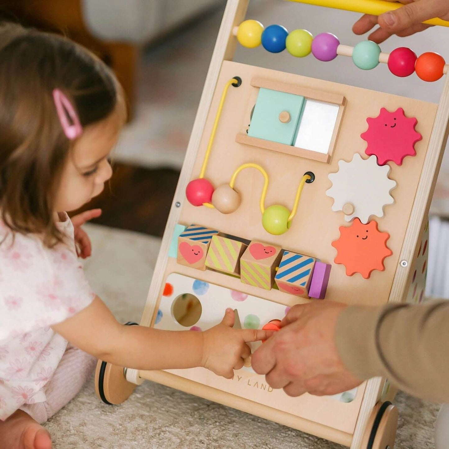 Girl Playing Tiny Land® Premium Natural Wooden Activity Walker