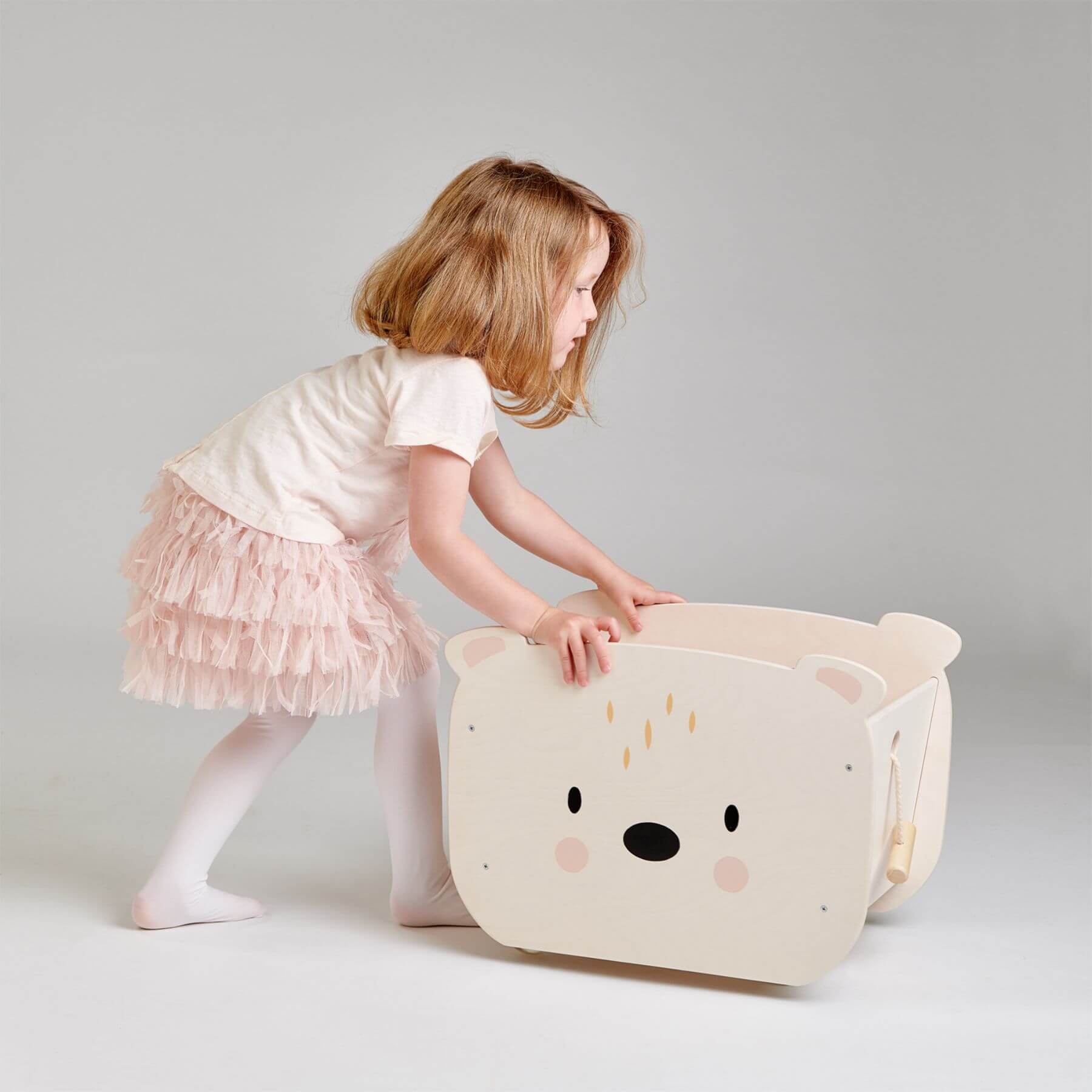 Child playing with Tender Leaf Pull Along Bear Cart