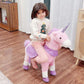 Child riding Qaba Ride On Real Walking Unicorn with Sparkly Horn Pink on a wooden floor.