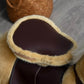 Close-up of Qaba Ride-on Walking Rolling Kids Horse Brown on a wooden floor.