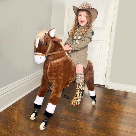 Child riding Qaba Kids Ride-on Walking Horse with Easy Rolling Wheels Brown indoors on a wooden floor.