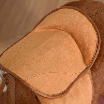 Close-up of a brown leather saddle pad with a soft interior.