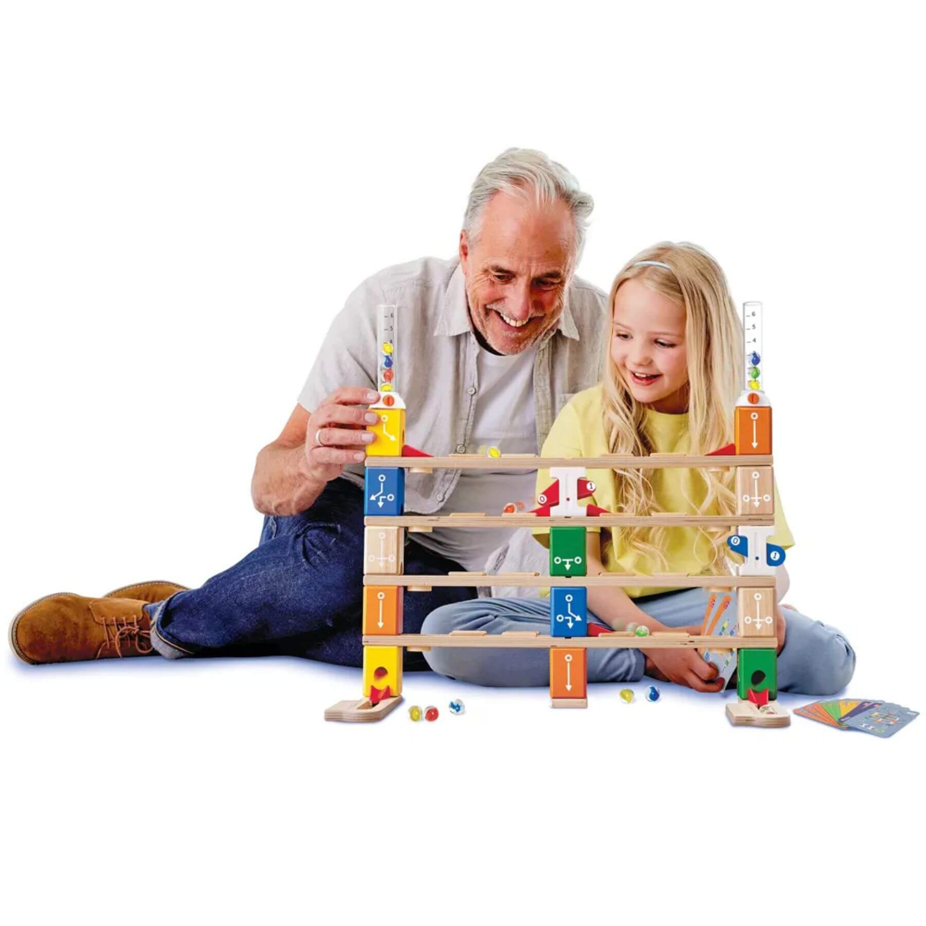 Grandpa and Girl Playing Hape Quadrilla Basic Coding Set