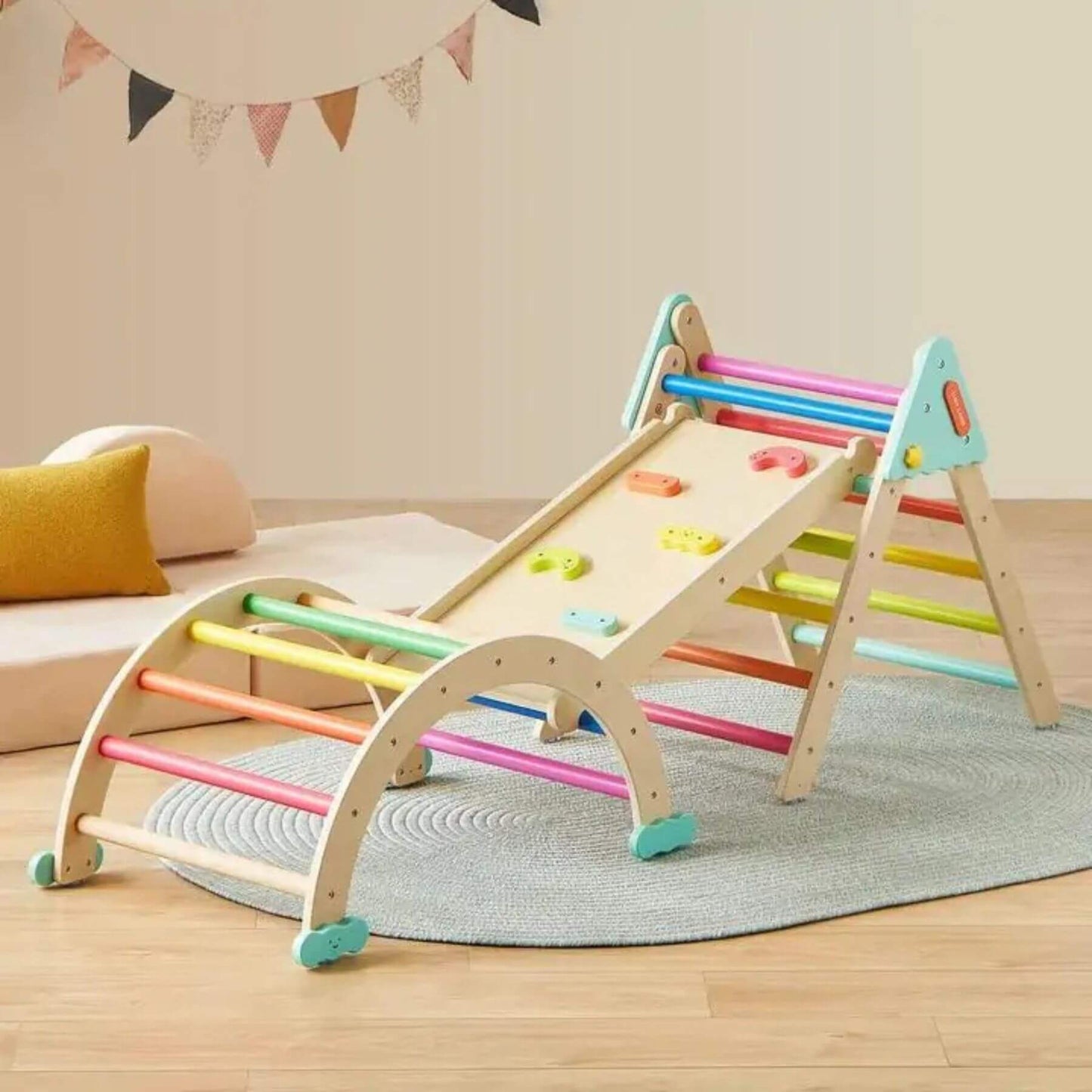 Tiny Land® 7-in-1 Rainbow Pikler Triangle Set in a room setting.