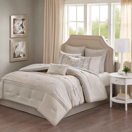Neatly made Ramsey Embroidered 8 Piece Comforter Set Neutral in a well-lit bedroom.