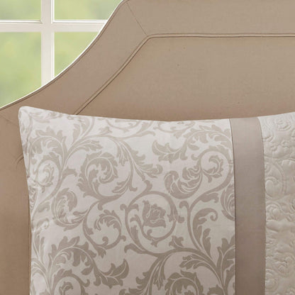 Decorative pillow with floral pattern on a beige bed