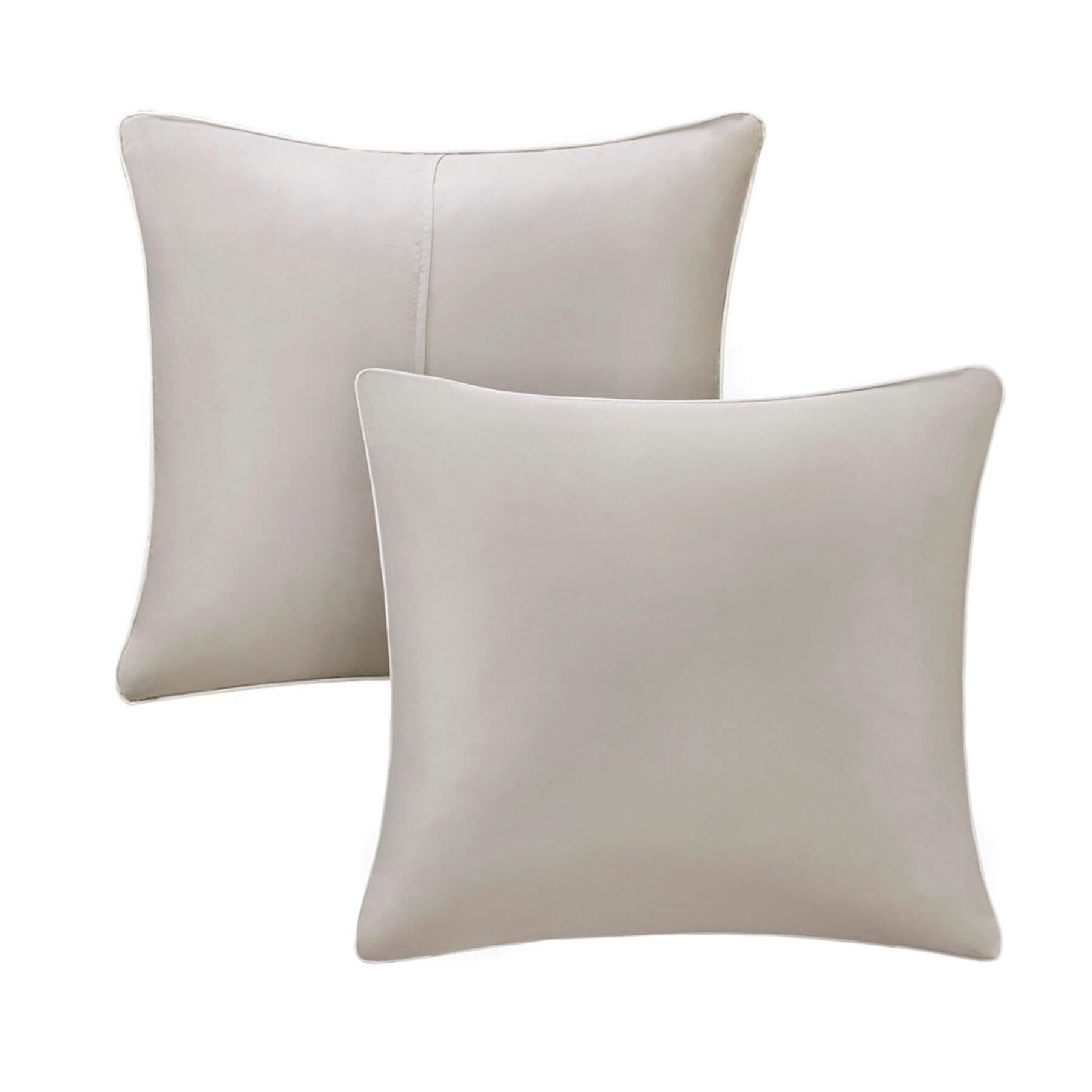 Two beige pillows on a white background