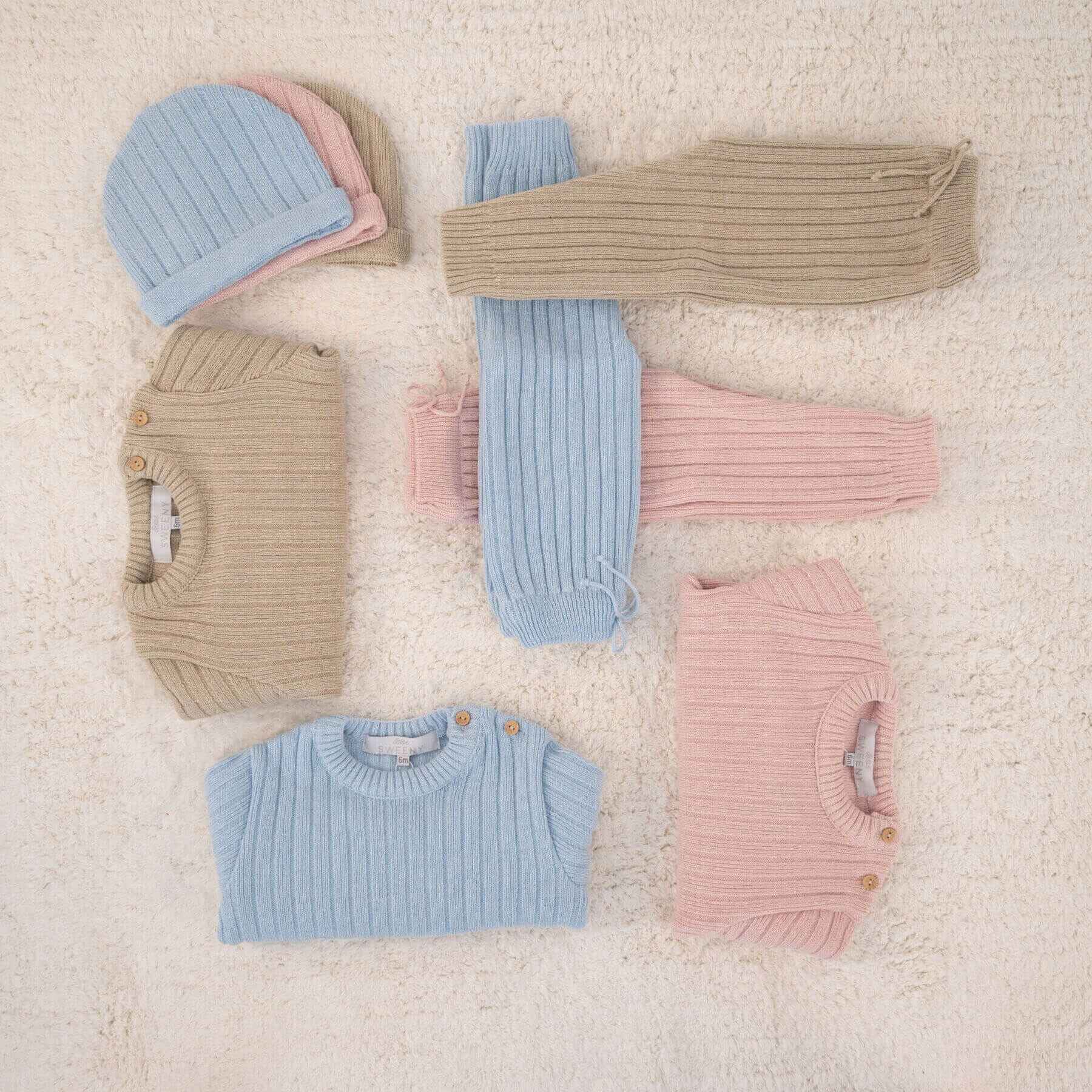 Collection of REMY | Beige Ribbed Knit Leggings Set on a textured beige surface