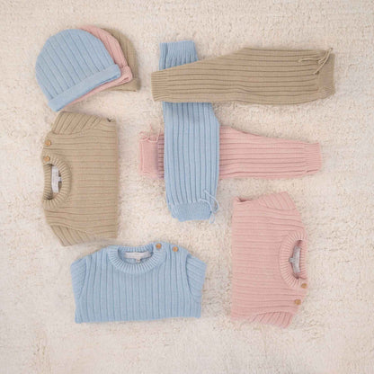 Collection of REMY | Beige Ribbed Knit Leggings Set on a textured beige surface
