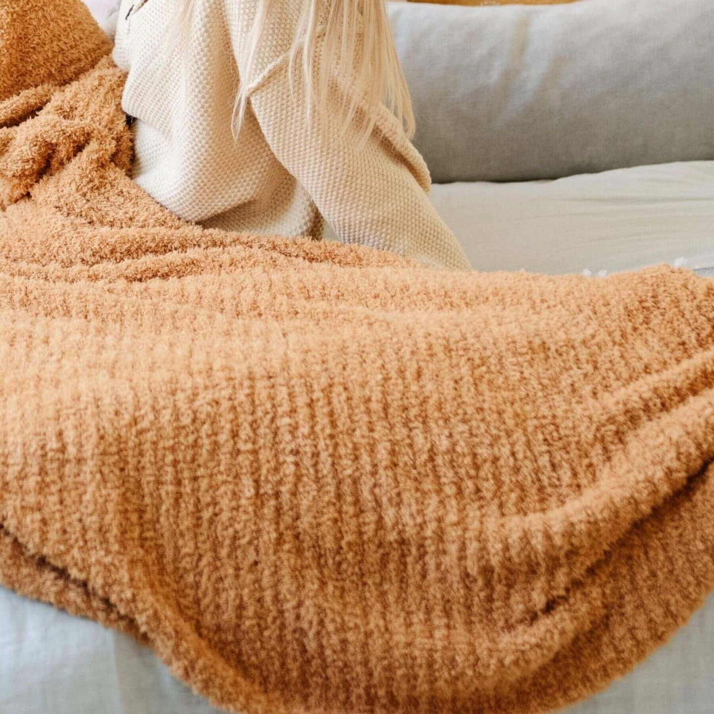 Saranoni Ribbed Bamboni® XL Blanket - Golden draped over a surface with a neutral background