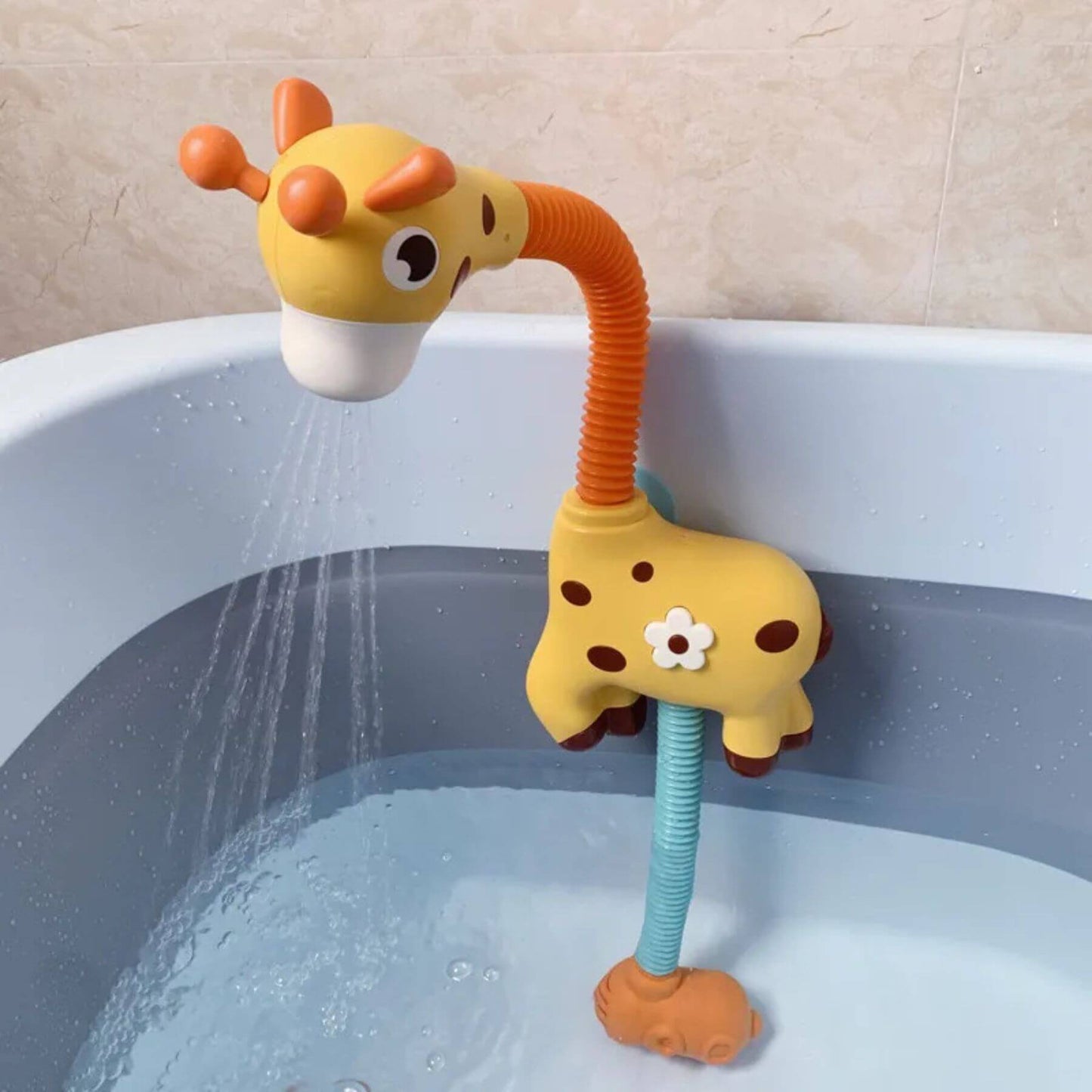 Giraffe-shaped bath toy with a flexible neck in a bathtub.