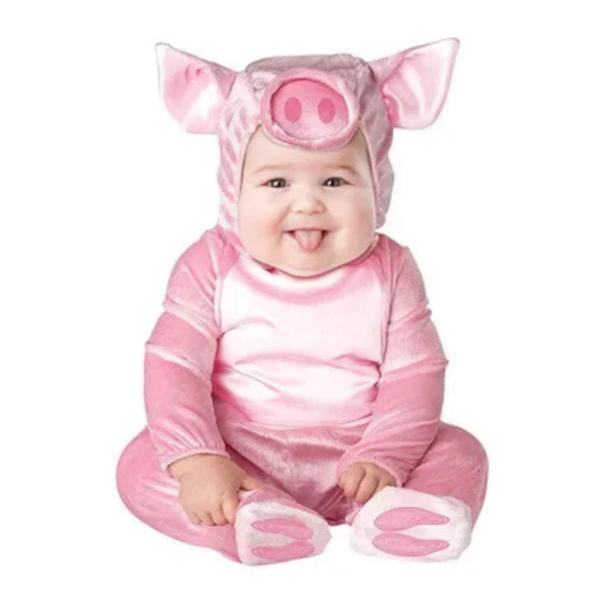 Baby in a pink pig costume on a white background