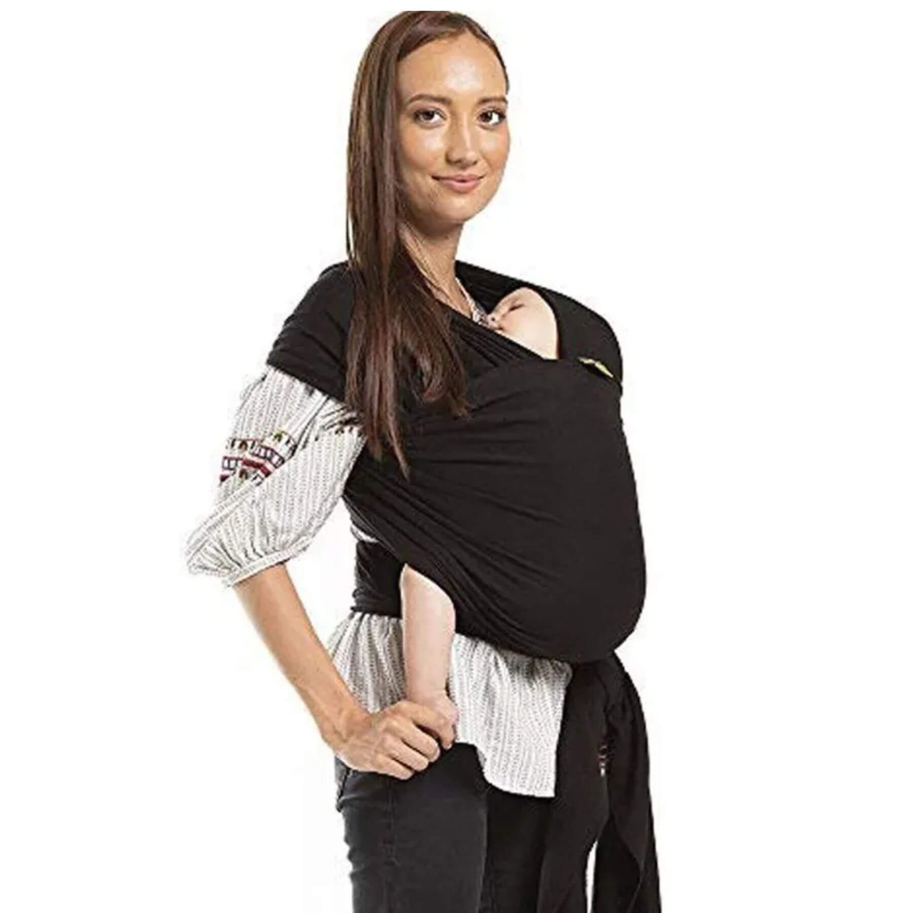 Woman wearing a black baby carrier on a white background