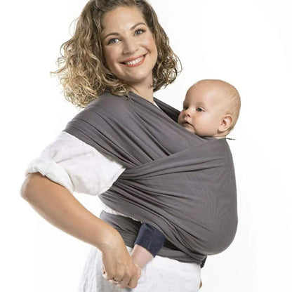 Woman holding a baby in RocketBaby USA Cotton Baby Wrap against a white background